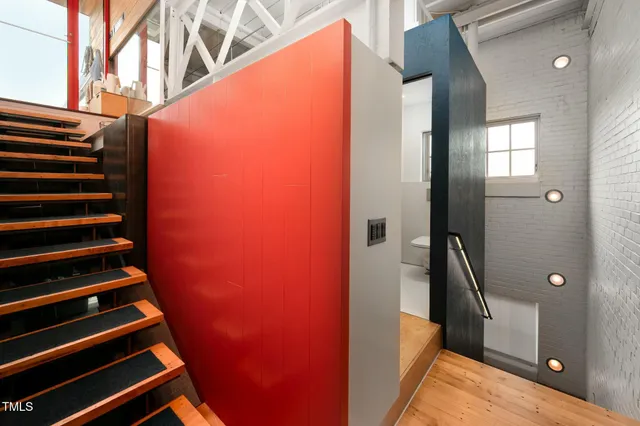 front view of a building with a garden