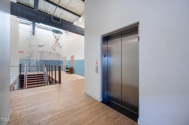 a view of a back yard of the house with a yard