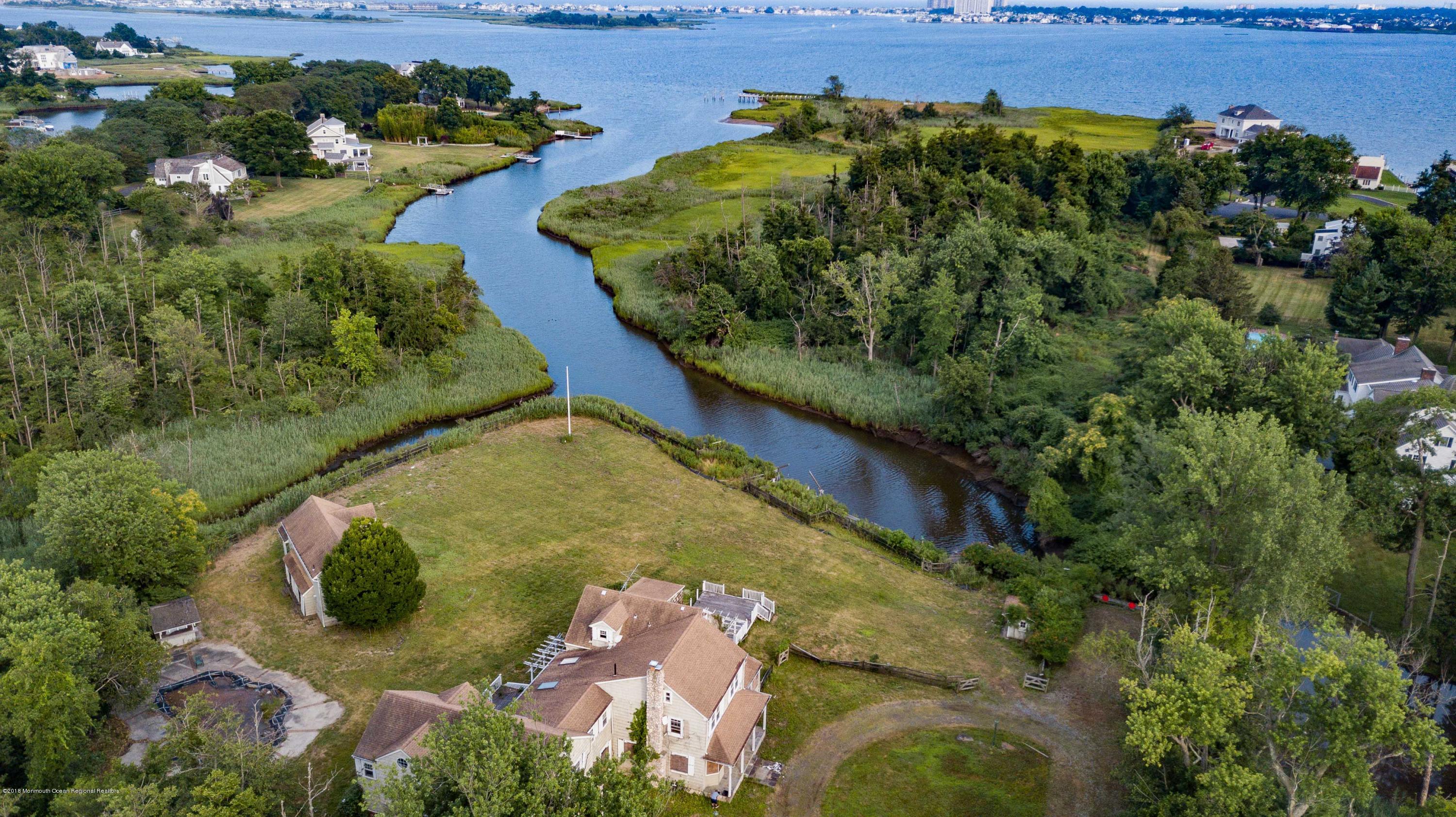 115 Rumson Road Rumson, NJ 07760 - Photo 1 of 8 an aerial view of a house with a yard
