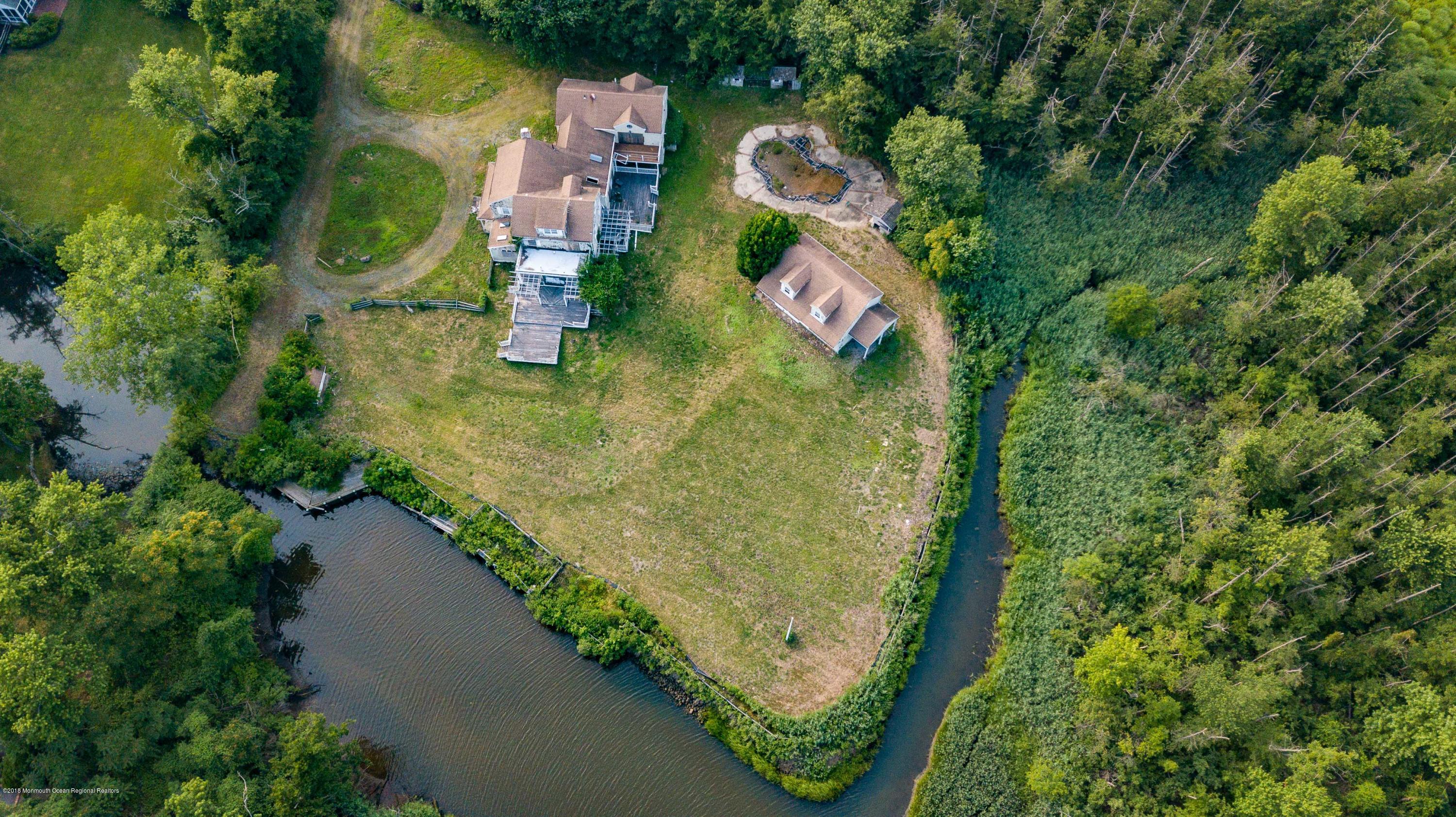 115 Rumson Road Rumson, NJ 07760 - Photo 3 of 8 an aerial view of residential house with outdoor space and trees all around