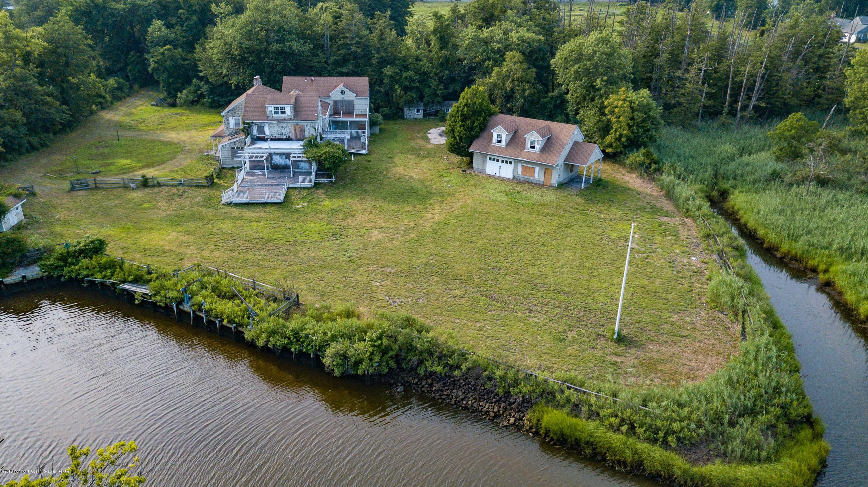 115 Rumson Road Rumson, NJ 07760 - Photo 4 of 8 an aerial view of a house with pool swimming pool and outdoor seating