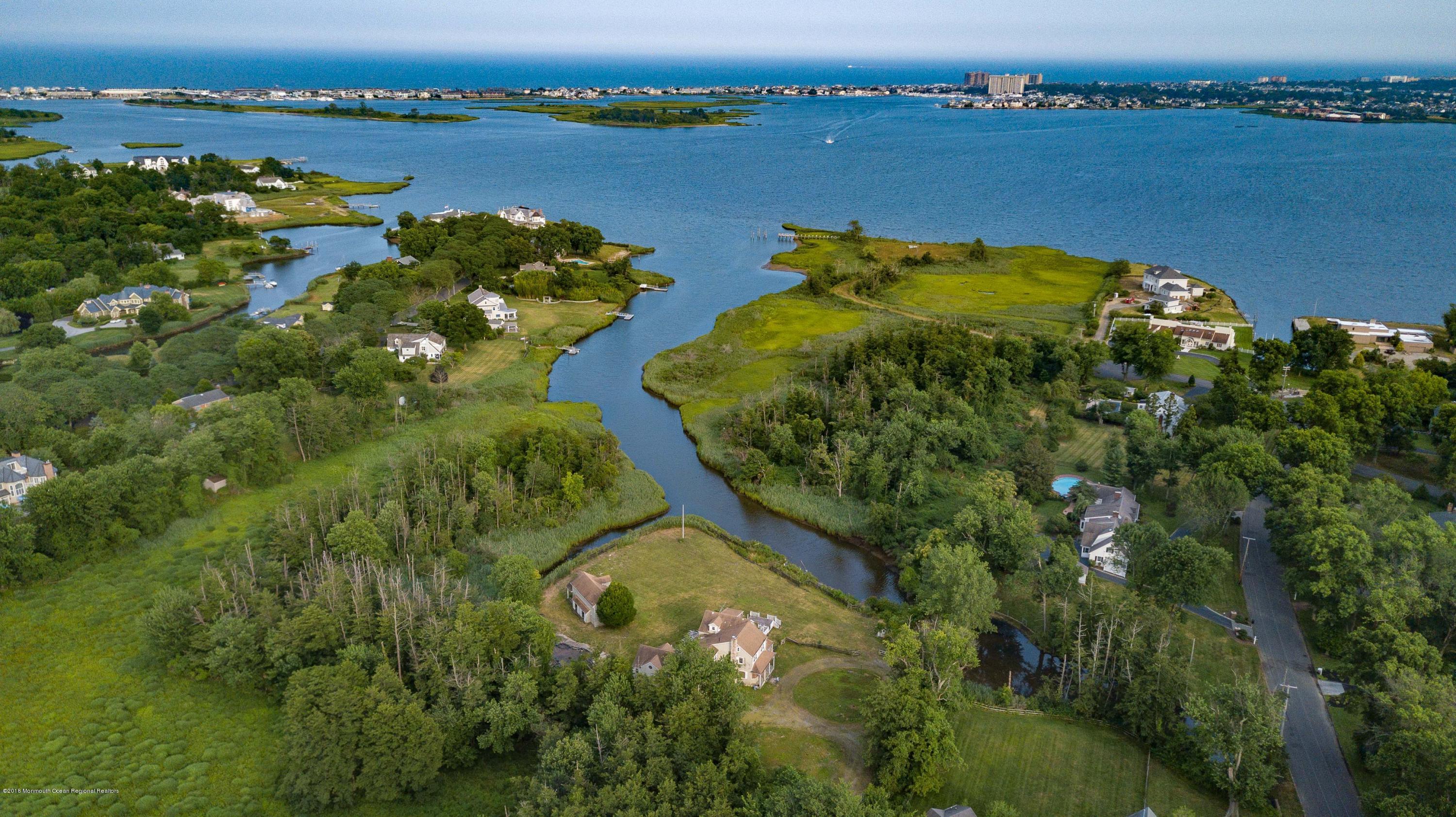 115 Rumson Road Rumson, NJ 07760 - Photo 6 of 8 an aerial view of lake residential houses with outdoor space and seating