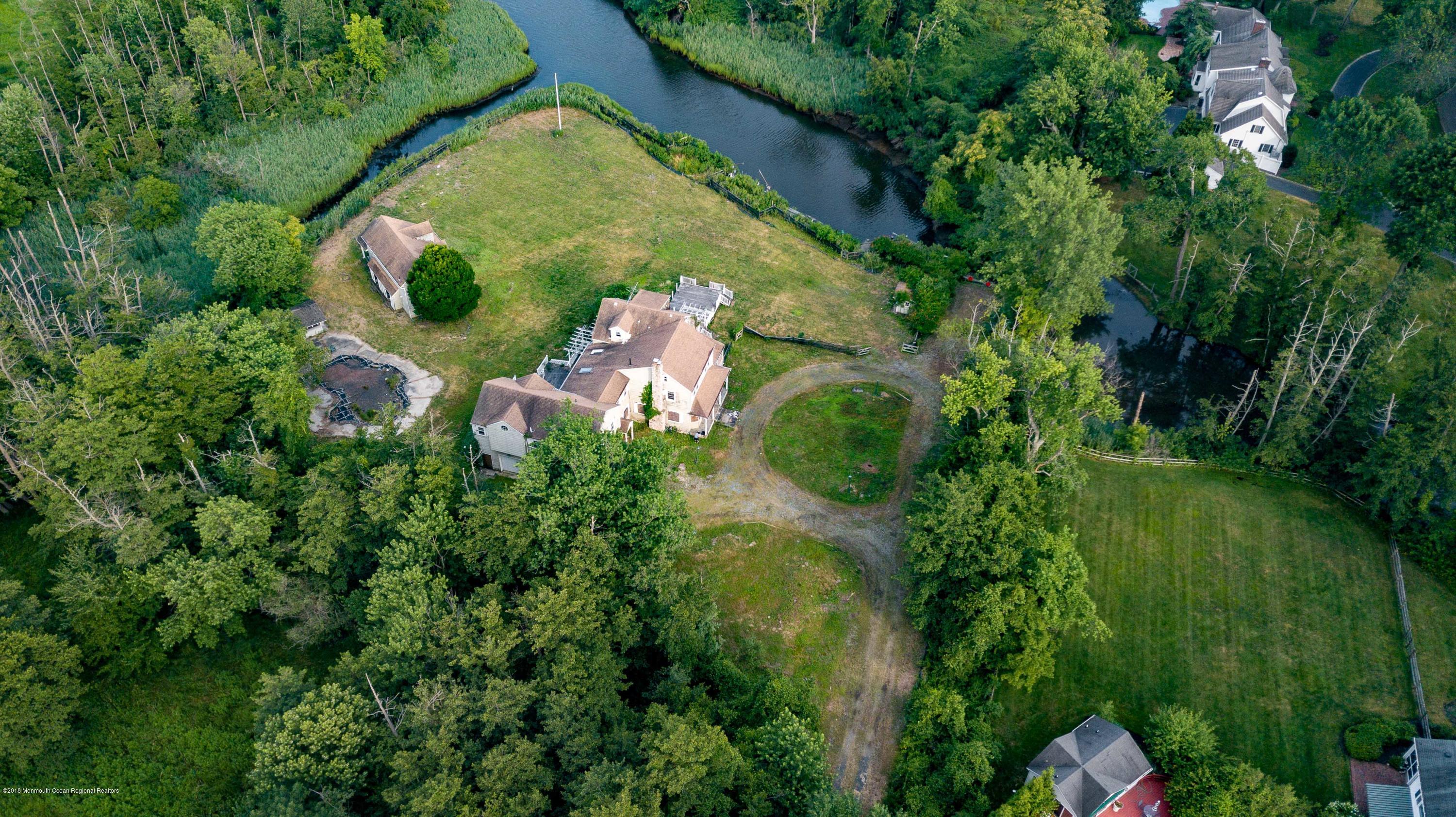 115 Rumson Road Rumson, NJ 07760 - Photo 8 of 8 an aerial view of residential house with outdoor space and trees all around