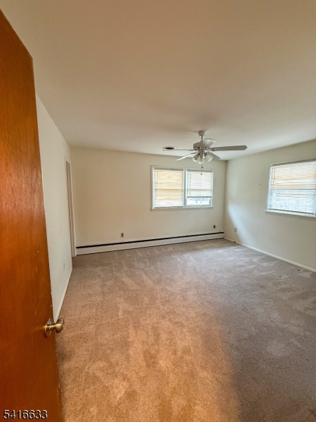 4032 Quakerbridge Road Lawrence Township, NJ 08648 - Photo 4 of 9 an empty room with windows and entrance