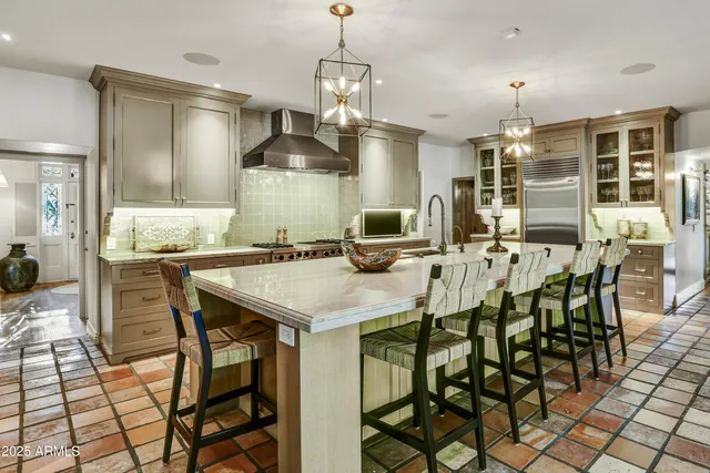 a kitchen with a table and chairs in it