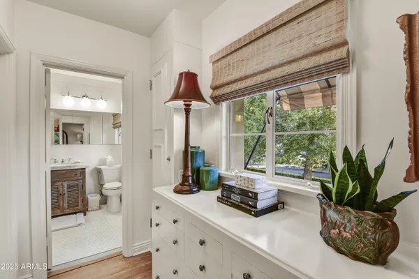a bedroom with bed and a window