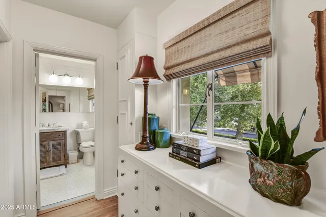 a bedroom with bed and a window