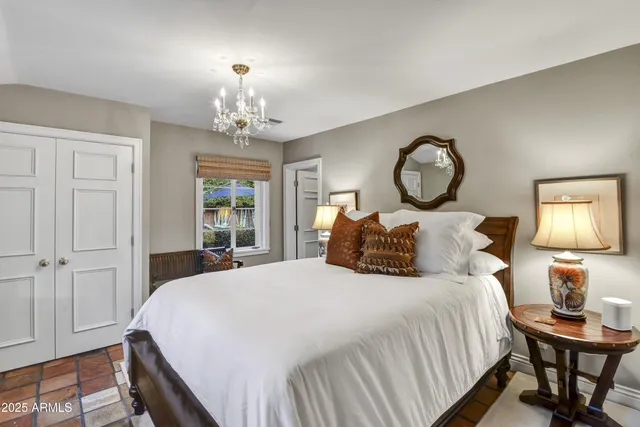 a living room with furniture a window and gym cycle
