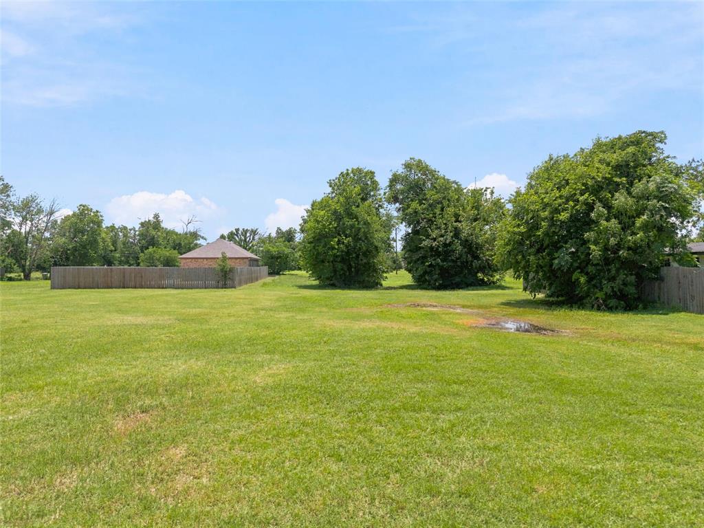 2825 South 7th Street Waco, TX 76706 - Photo 6 of 11 a view of a field with trees in the background