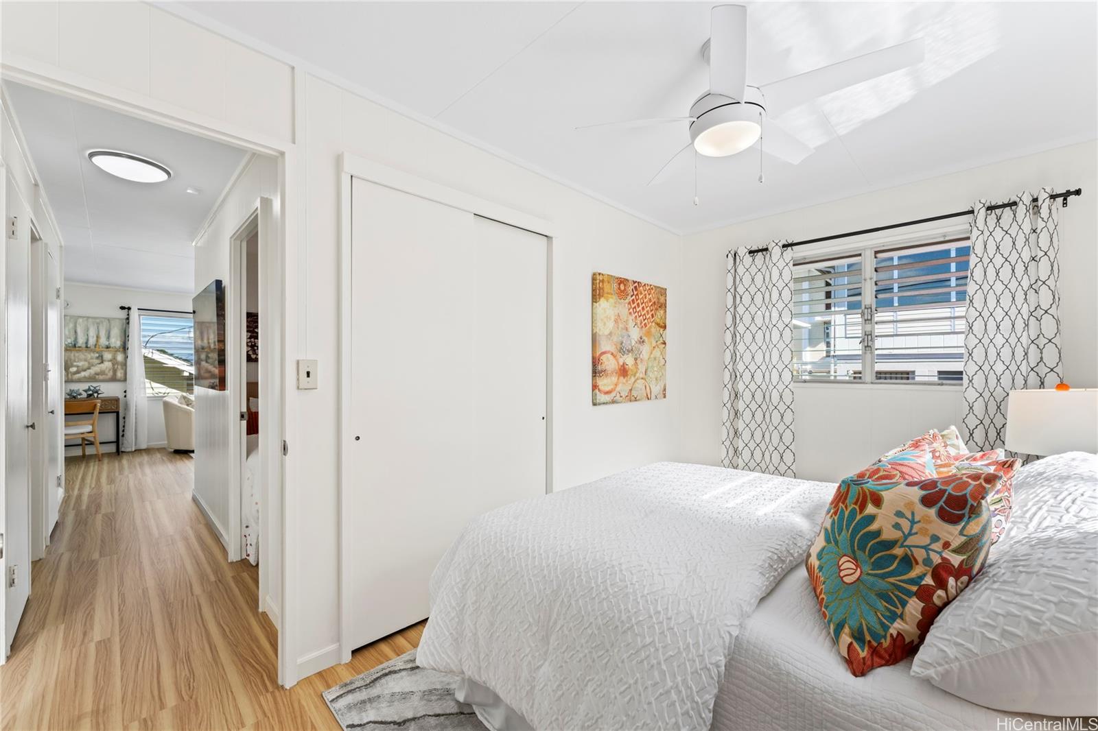 125 Milo Lane Honolulu, HI 96813 - Photo 9 of 16 a bedroom with a bed and wooden floor