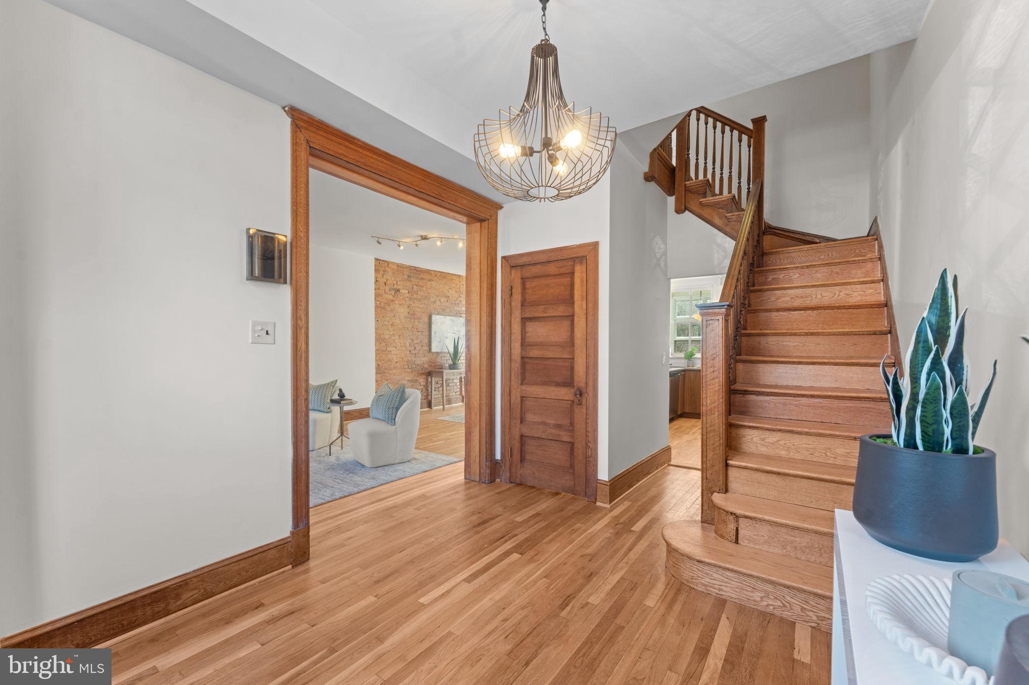 1802 Lamont Street Northwest Washington, DC 20010 - Photo 6 of 118 a view of a hallway with wooden floor and staircase