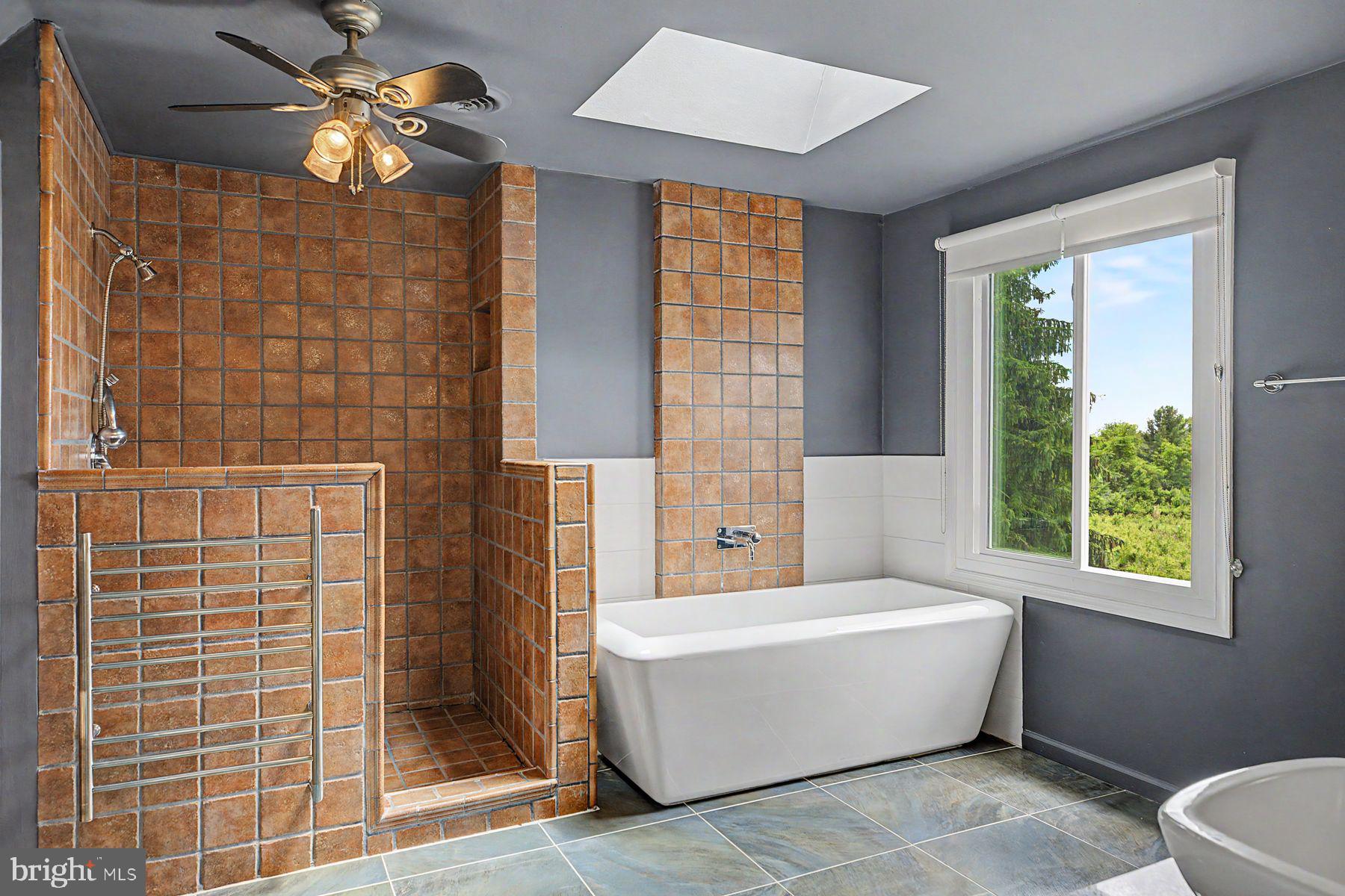 4009 Smoke Road Doylestown, PA 18902 - Photo 32 of 52 a bathroom with a bathtub and a shower