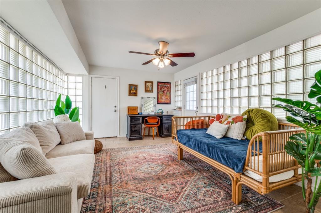 4303 Skillman Street Dallas, TX 75206 - Photo 14 of 25 a living room with furniture and a chandelier