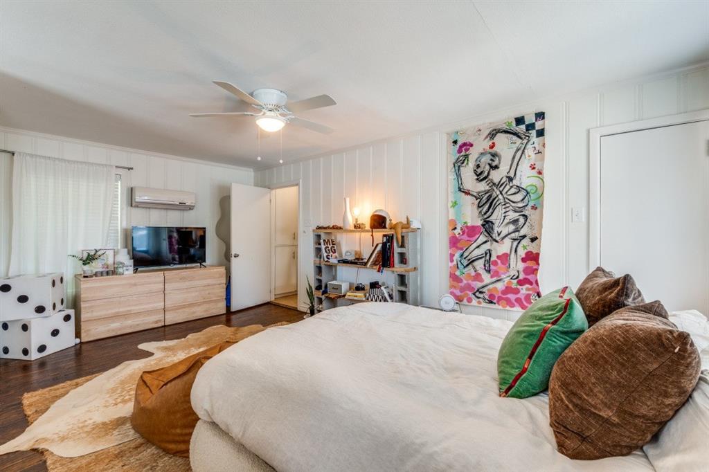 4303 Skillman Street Dallas, TX 75206 - Photo 20 of 25 a bedroom with a bed and a couch