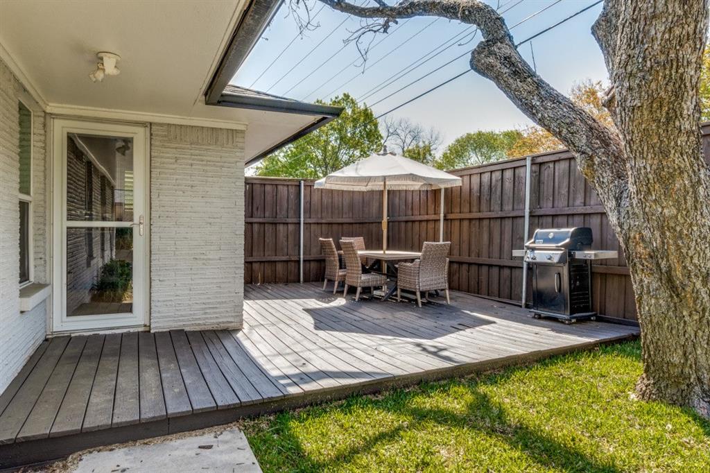 4303 Skillman Street Dallas, TX 75206 - Photo 22 of 25 a view of a backyard with sitting area and furniture