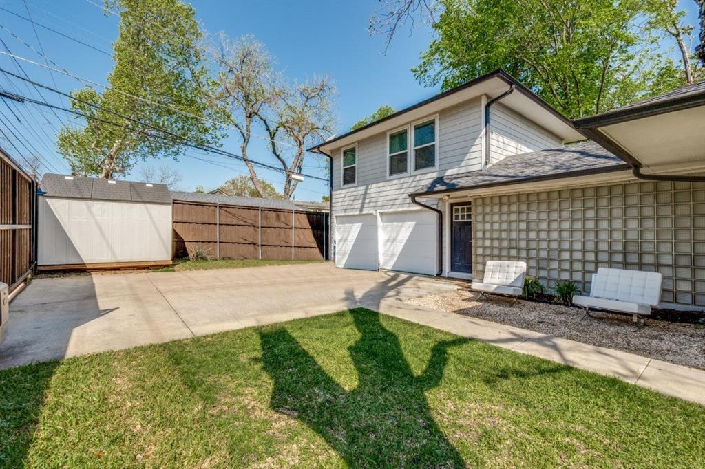 4303 Skillman Street Dallas, TX 75206 - Photo 24 of 25 a front view of a house with a garden