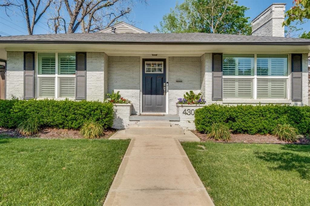 4303 Skillman Street Dallas, TX 75206 - Photo 3 of 25 front view of a house with a yard