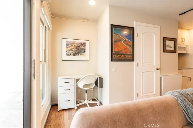 a bedroom with a bed and a lamp