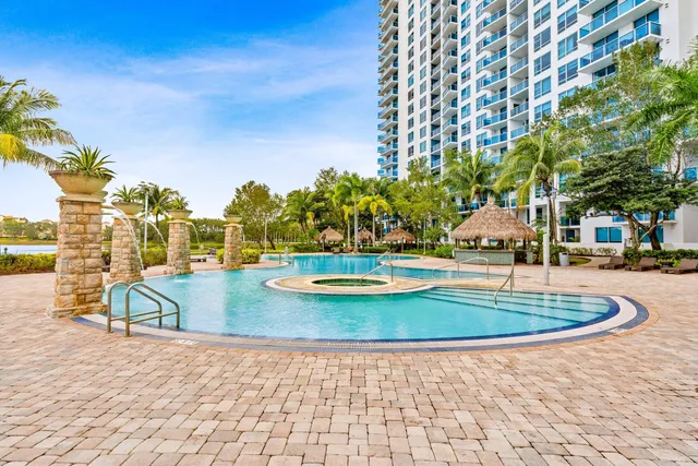 a view of a swimming pool with a patio