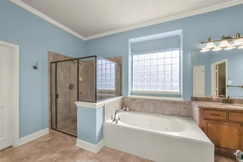 a bathroom with a bathtub and a sink