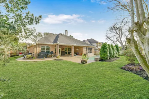 a front view of a house with yard porch and furniture
