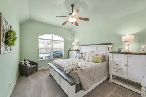 a bedroom with a bed and window