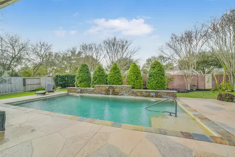a view of a swimming pool with a patio