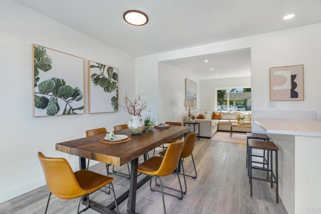 935 Swallow Drive Vista, CA 92083 - Photo 16 of 43 a view of a dining room with furniture and wooden floor