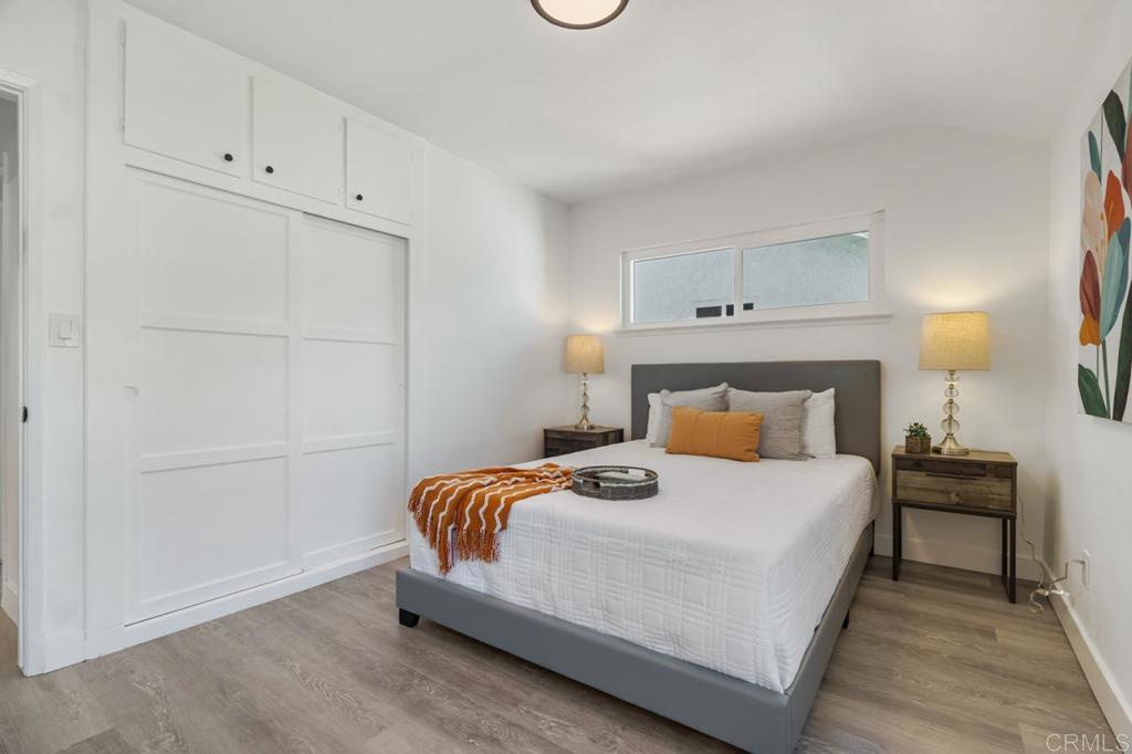 935 Swallow Drive Vista, CA 92083 - Photo 26 of 43 a bedroom with a bed and a night stand