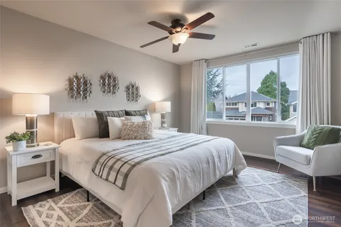 a bedroom with a large bed and a couch