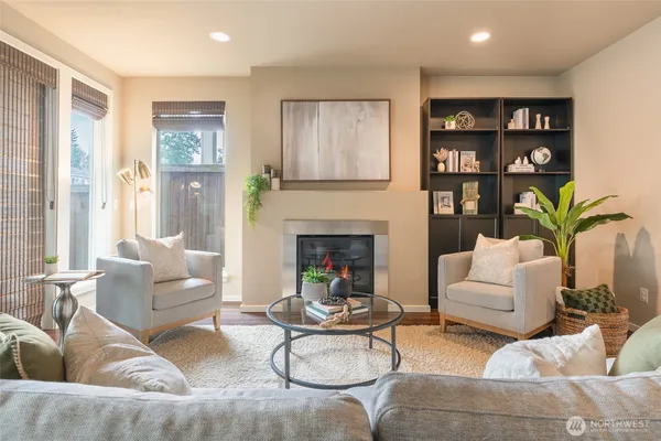 a living room with furniture and a fireplace