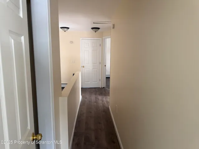 a view of a bathroom from the hallway