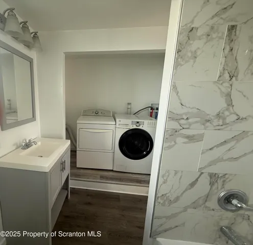 a utility room with dryer and washer