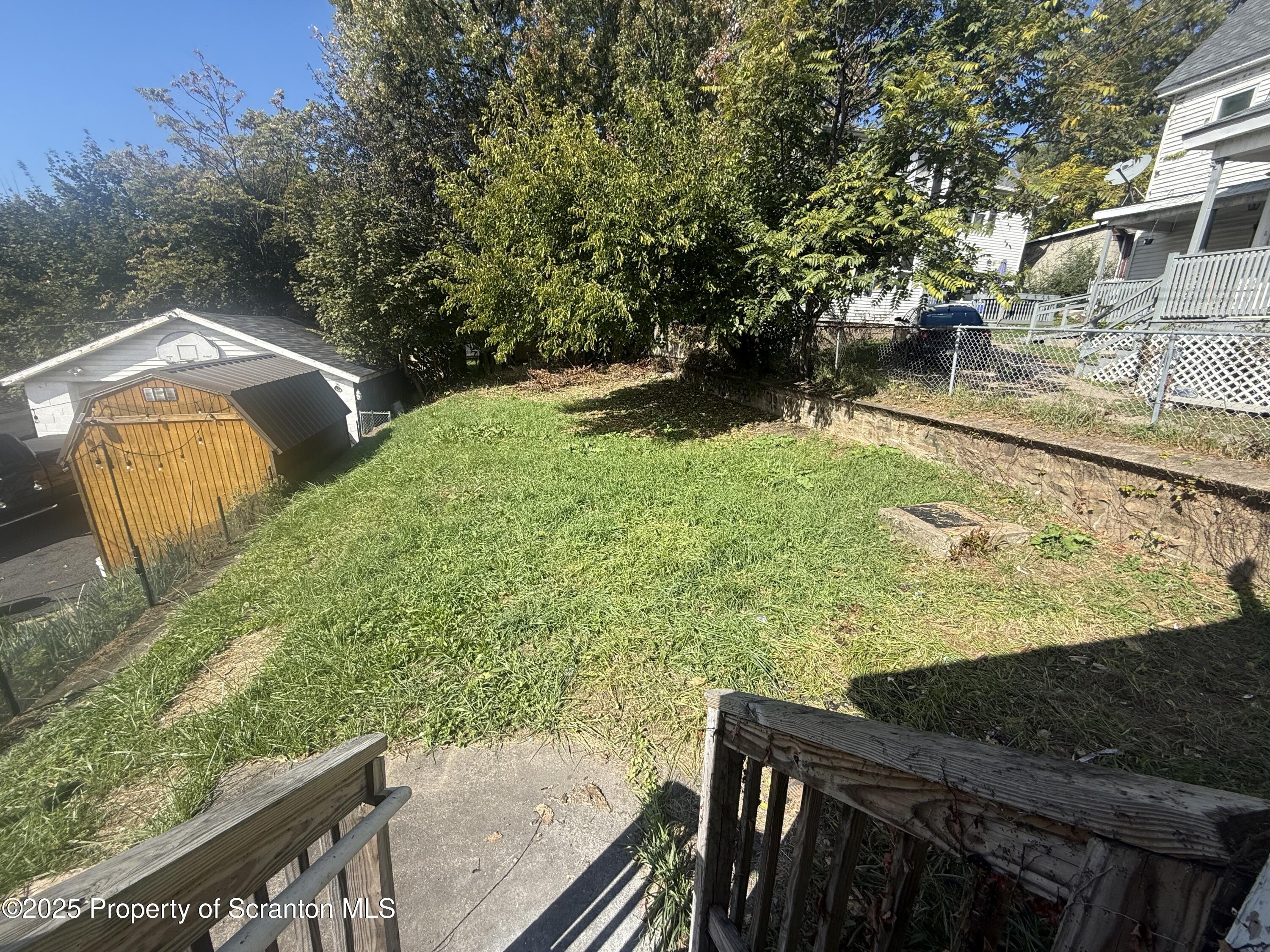 154 South Sumner Avenue Scranton, PA 18504 - Photo 15 of 15 a view of a yard with wooden fence