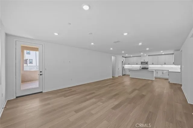 a view of room with window and ceiling fan