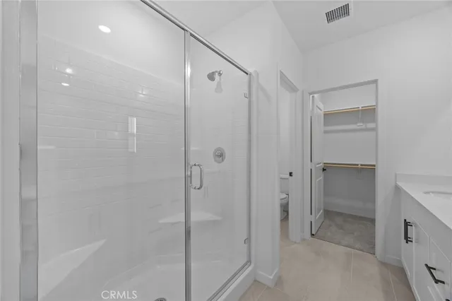 a view of an empty walk in closet