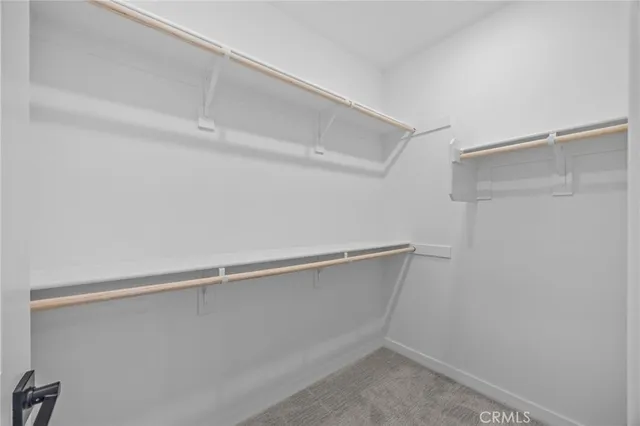 a bathroom with double vanity sinks and a mirror