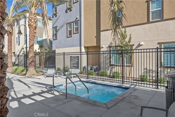 a view of a swimming pool with chairs