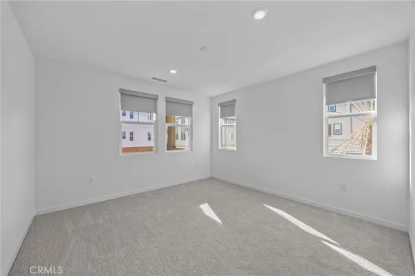 a view of room with window and ceiling fan