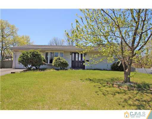 19 New Road Kendall Park, NJ 08824 - Photo 1 of 21 a view of a house with backyard and garden