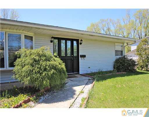 19 New Road Kendall Park, NJ 08824 - Photo 2 of 21 a view of a house with a yard