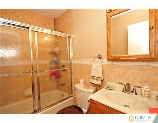 19 New Road Kendall Park, NJ 08824 - Photo 13 of 21 a bathroom with a sink and a shower