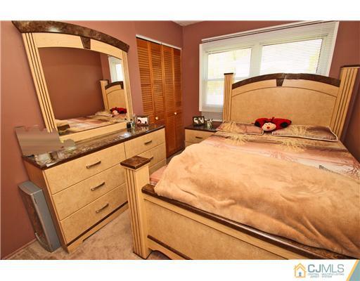 19 New Road Kendall Park, NJ 08824 - Photo 16 of 21 a bathroom with a sink and a mirror