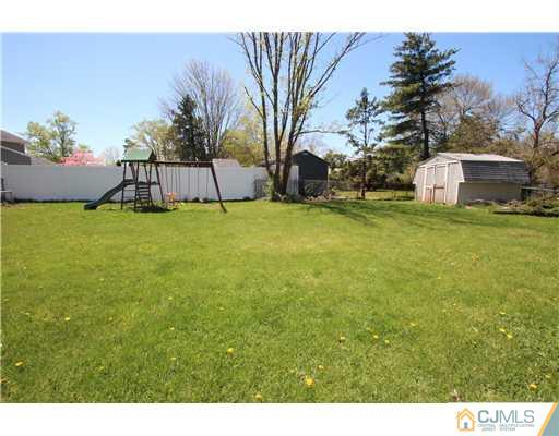 19 New Road Kendall Park, NJ 08824 - Photo 20 of 21 a view of a back yard of the house
