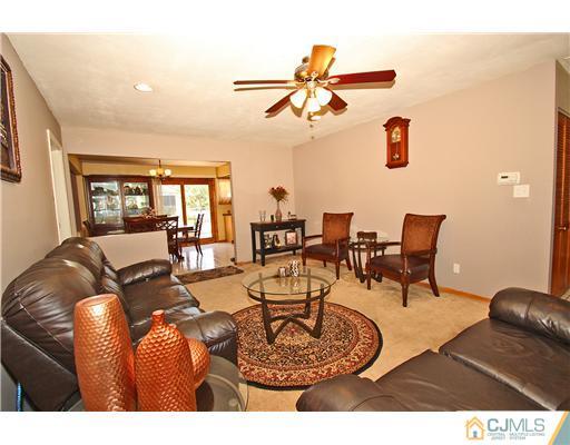 19 New Road Kendall Park, NJ 08824 - Photo 5 of 21 a living room with furniture and a window
