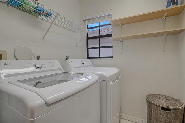 a view of an empty room with large windows