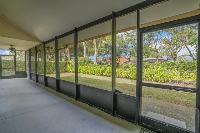 a view of a room with a floor to ceiling window