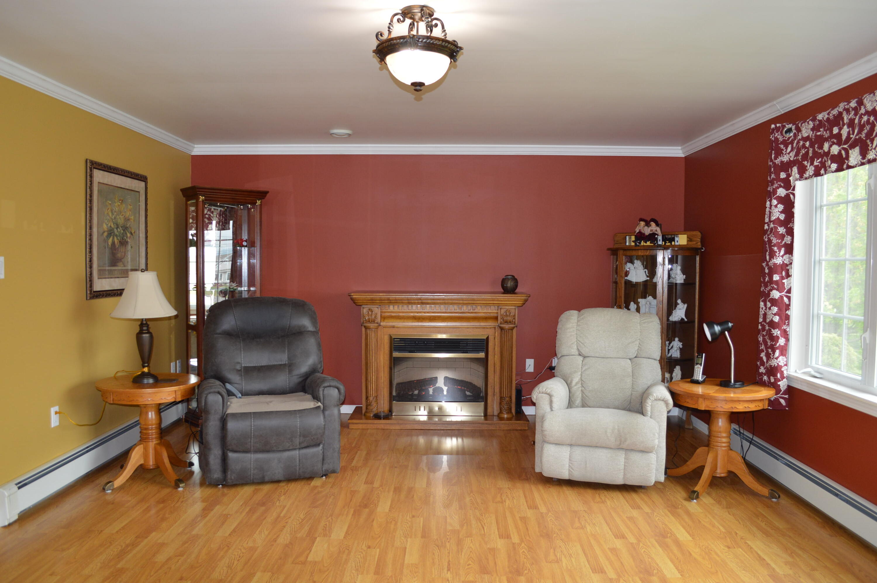 25 Pine Street Fort Kent, ME 04743 - Photo 21 of 32 Living room with electric fireplace