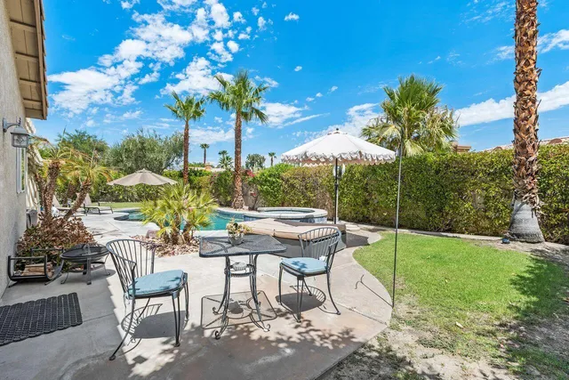 a view of an chairs and tables in the patio