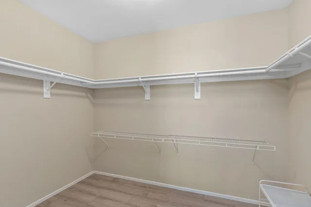 a view of an empty walk in closet